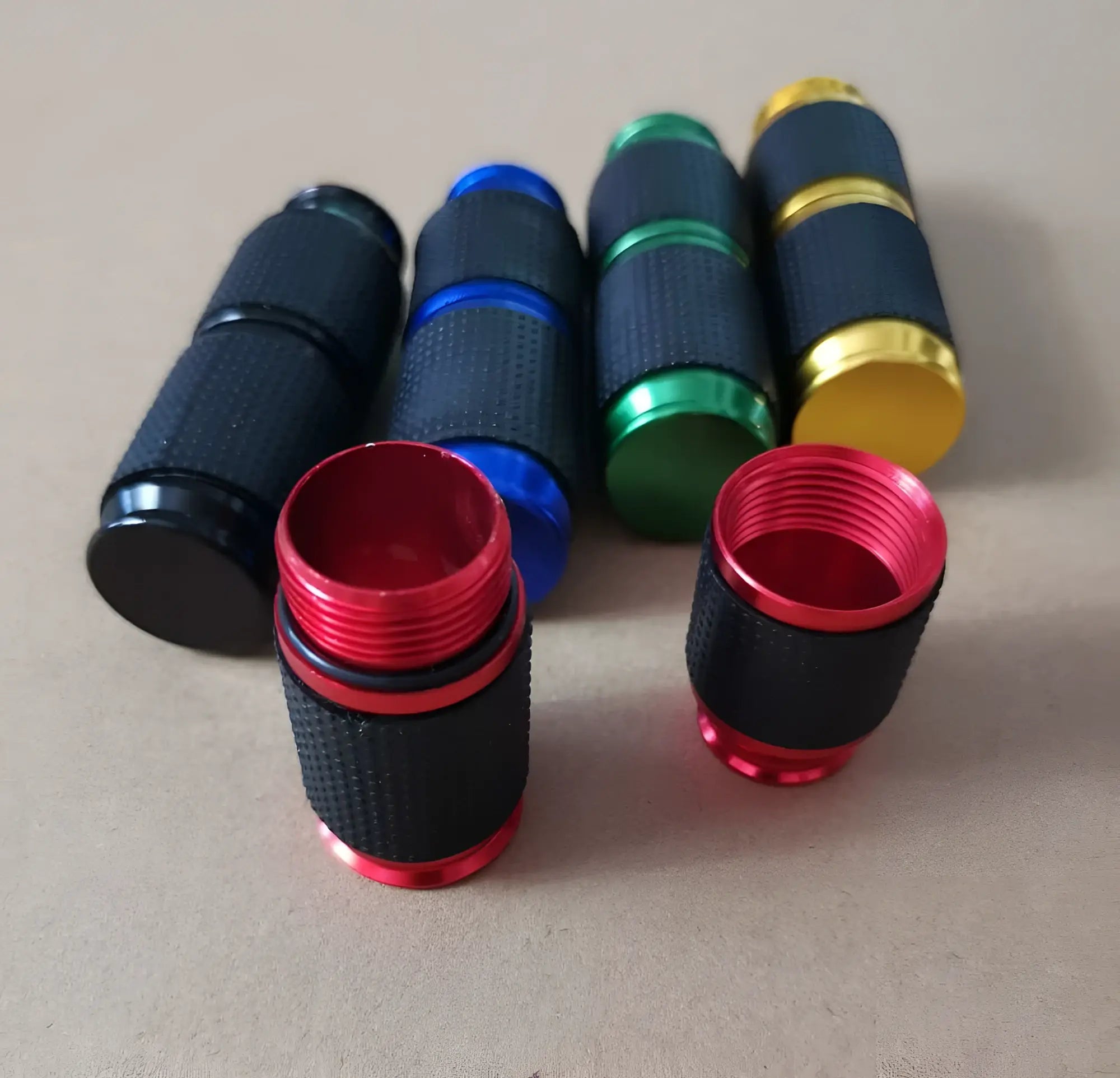 Colorful textured aluminum assist n2o whipped cream gas cracker valve caps in black with red and gold accents for 8g charger
