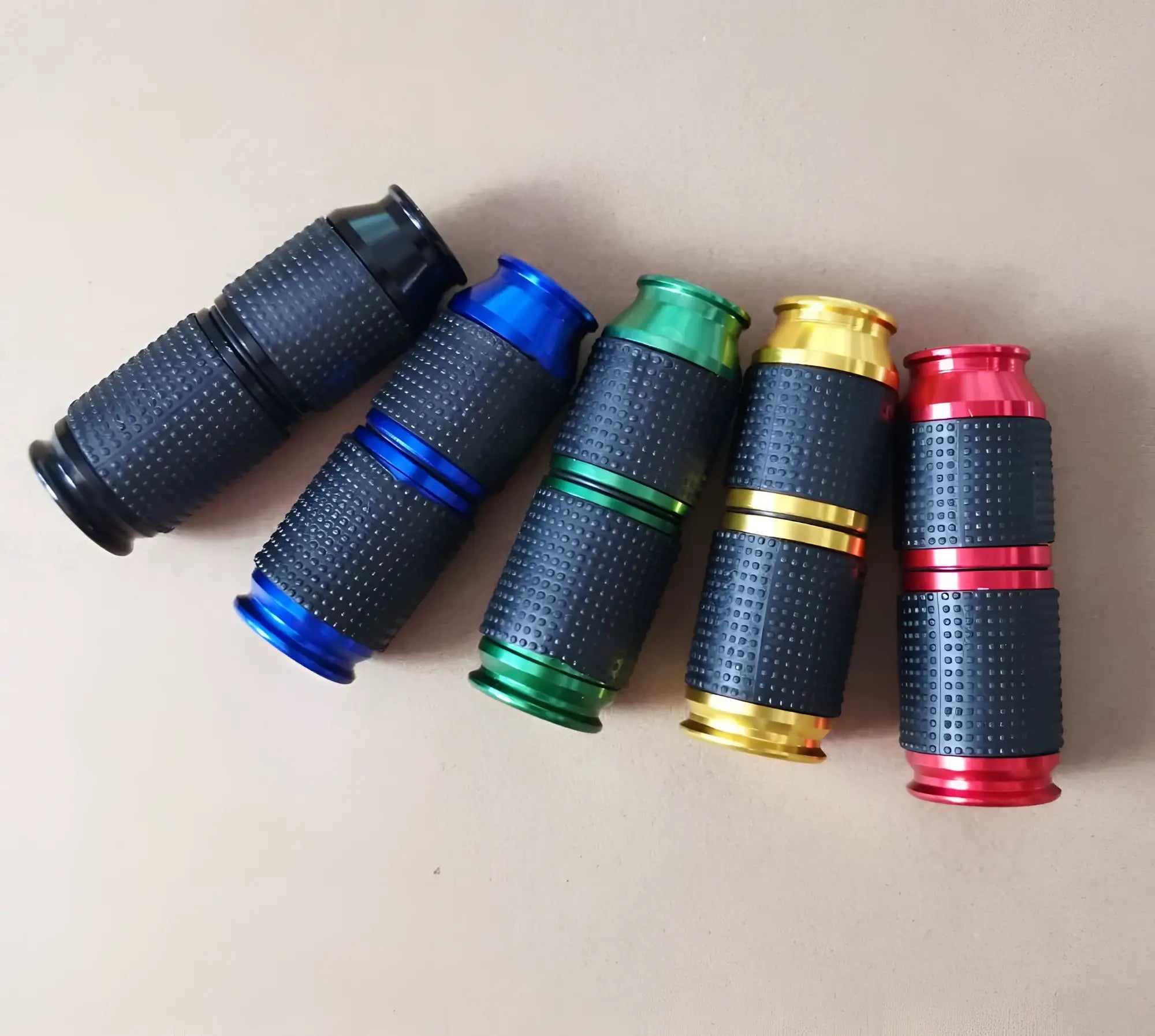 Set of five colorful textured black motorcycle pedal covers with metallic accents for assist n2o whipped cream gas cracker