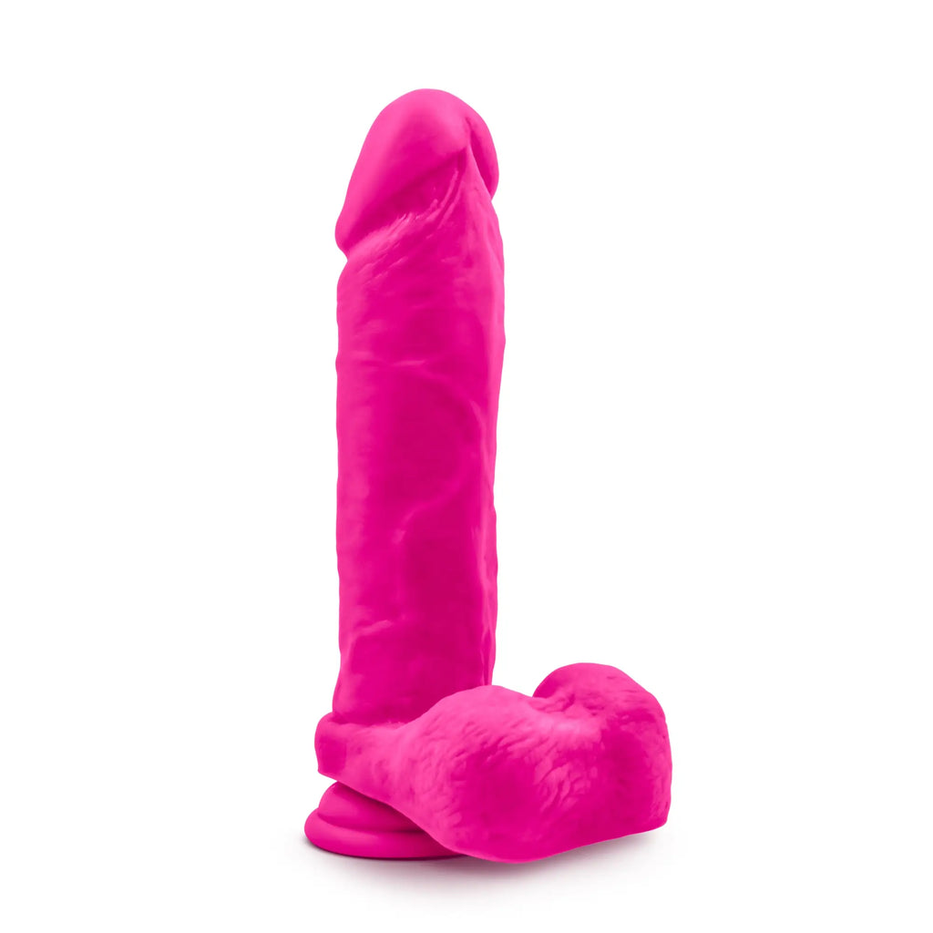 Vibrant pink silicone dildo with a textured realistic design and rounded base from Au Naturel Bold Massive 9in collection