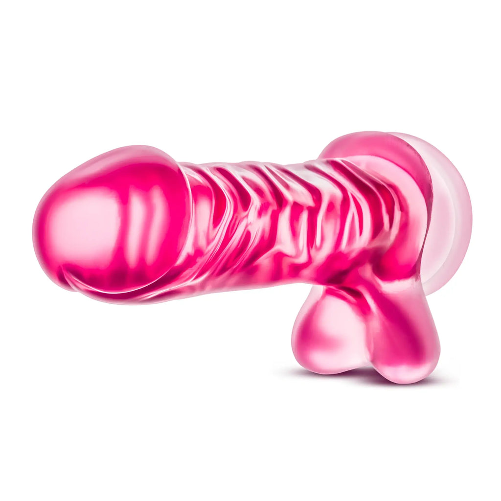 A translucent pink silicone toy with ribbed texture and rounded ends from b yours b yours basic 8 pink collection