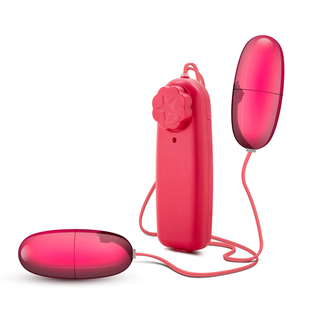 Pink silicone double pop eggs vibrator with matching remote control featuring flower-like button cerise color