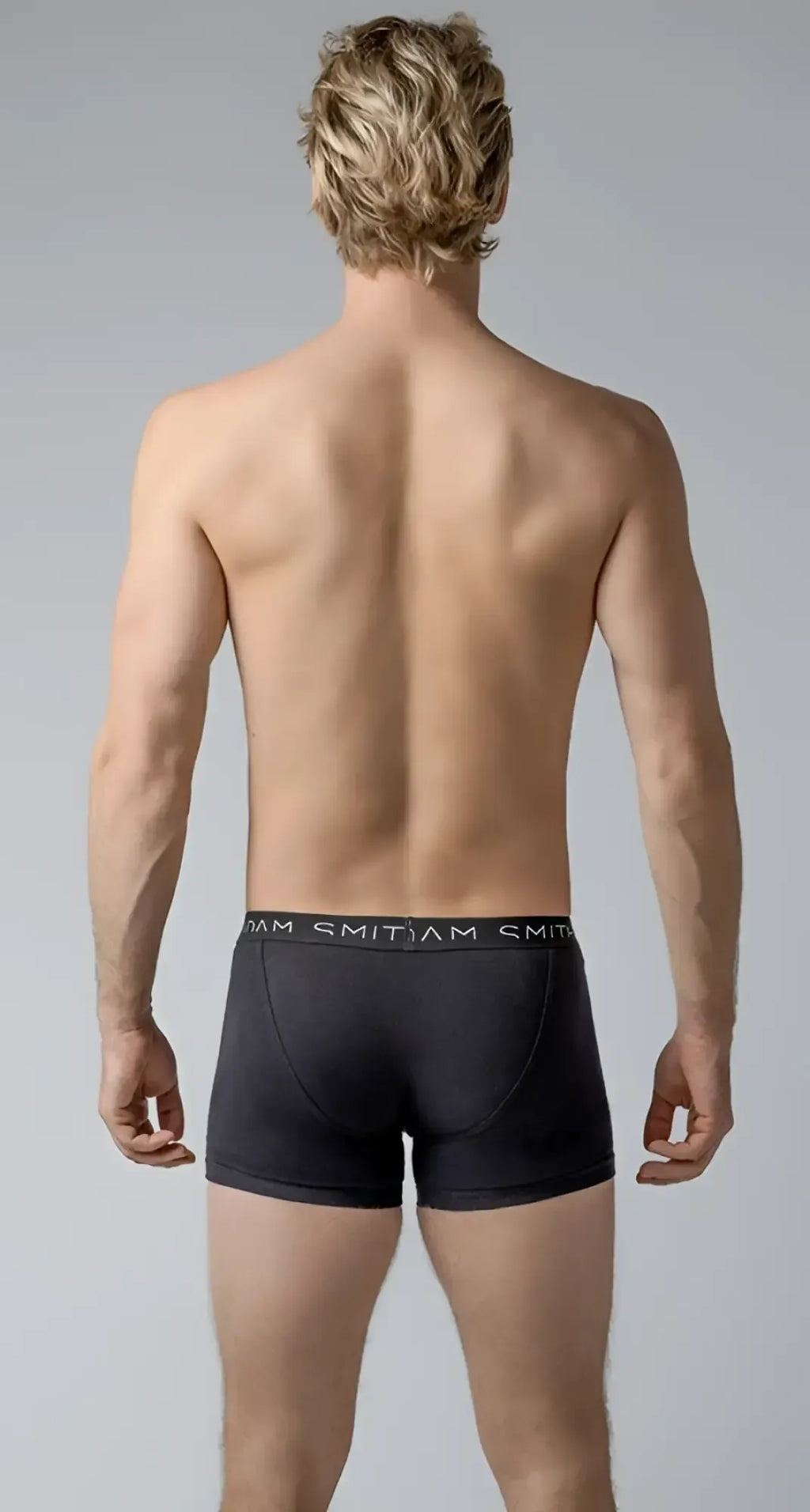 Black menâs briefs basic trunks with a snug fit elastic waistband and smitjam brand name in white lettering