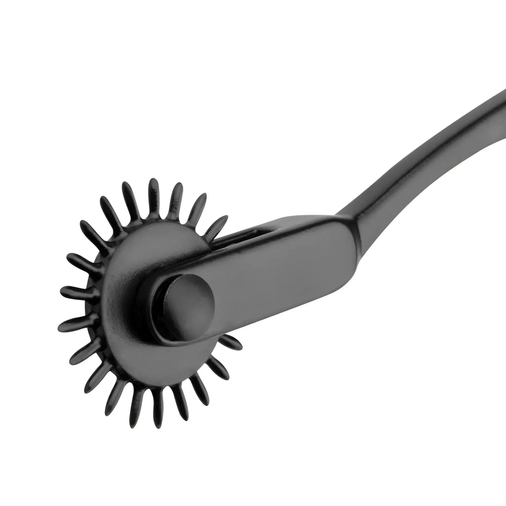 Black aluminium pinwheel with spiked teeth and curved handle from bedroom fantasies for sensory play