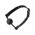 Black leather gag featuring a matte black breathable silicone ball for bedroom fantasies use