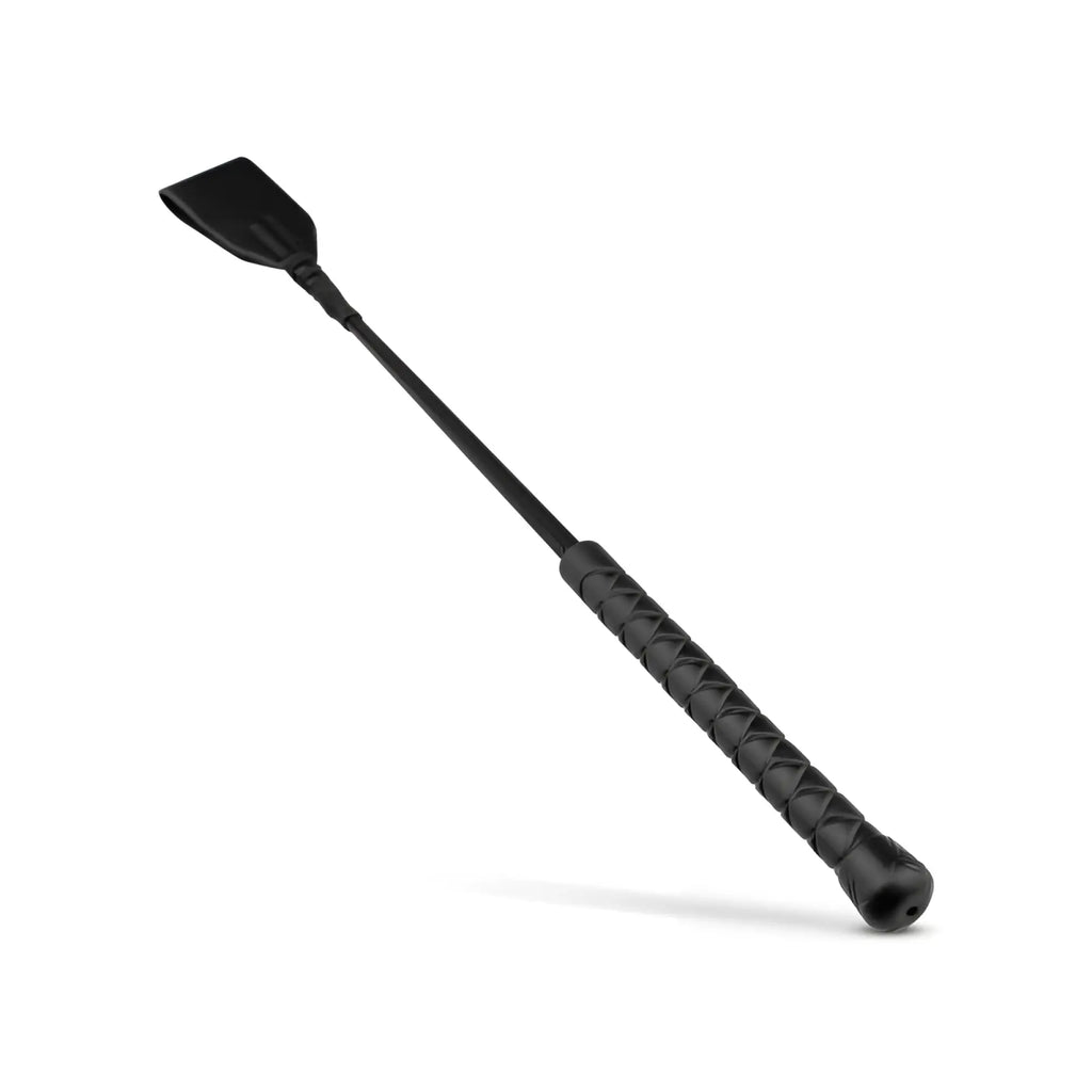 Bedroom Fantasies faux leather crop whip in black with textured grip and flat slightly curved head for riding use
