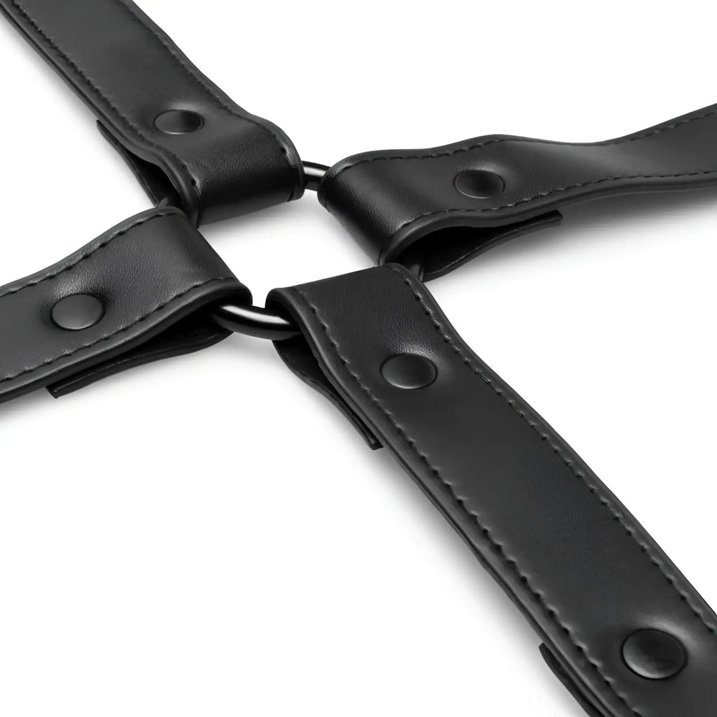 Black leather bedroom fantasies hog tie with stitched edges and metal rivets for secure restraint play