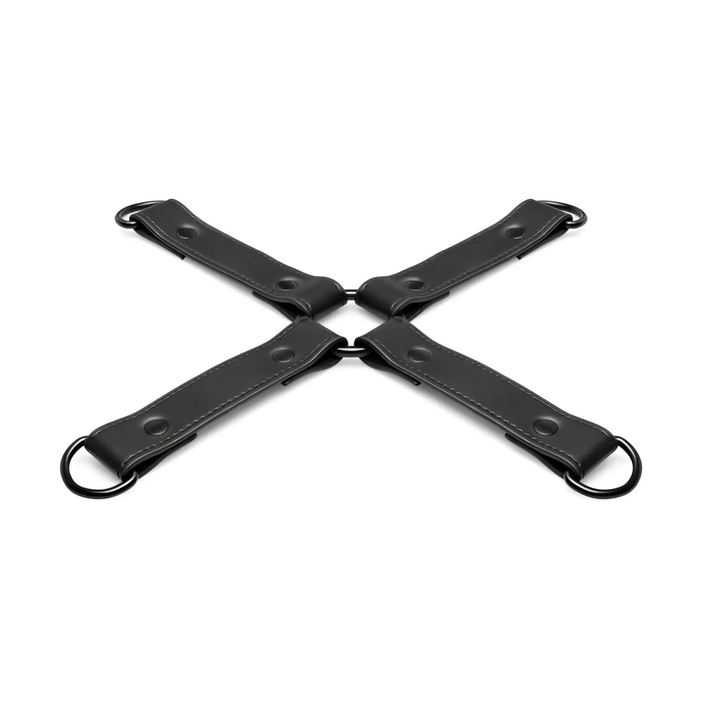 Black leather x-shaped restraint strap with metal rings and rivets for bedroom fantasies hog tie black bondage use