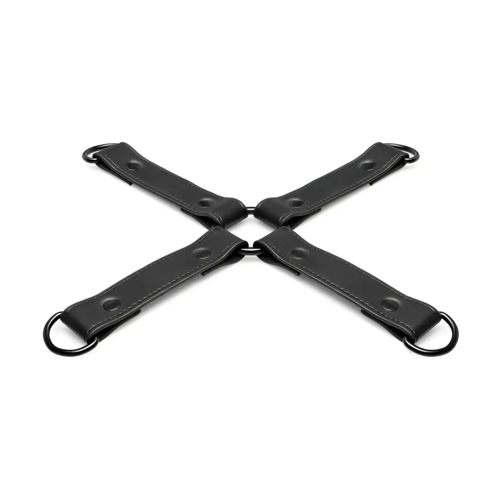 Black leather x-shaped restraint strap with metal rings and rivets for bedroom fantasies hog tie black bondage use