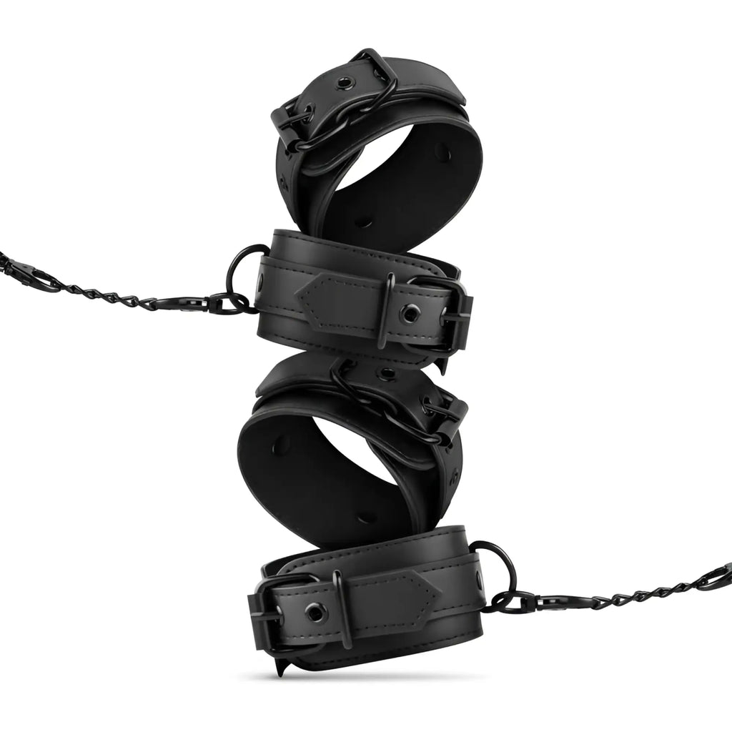 Black leather wrist and ankle cuffs with metal buckles and chains from bedroom fantasies kinky bondage set 5 pc black