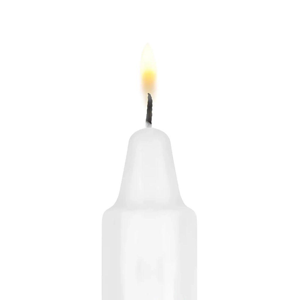 A white candle with a steady flame included in the bedroom fantasies kinky bondage set 5 pc black collection