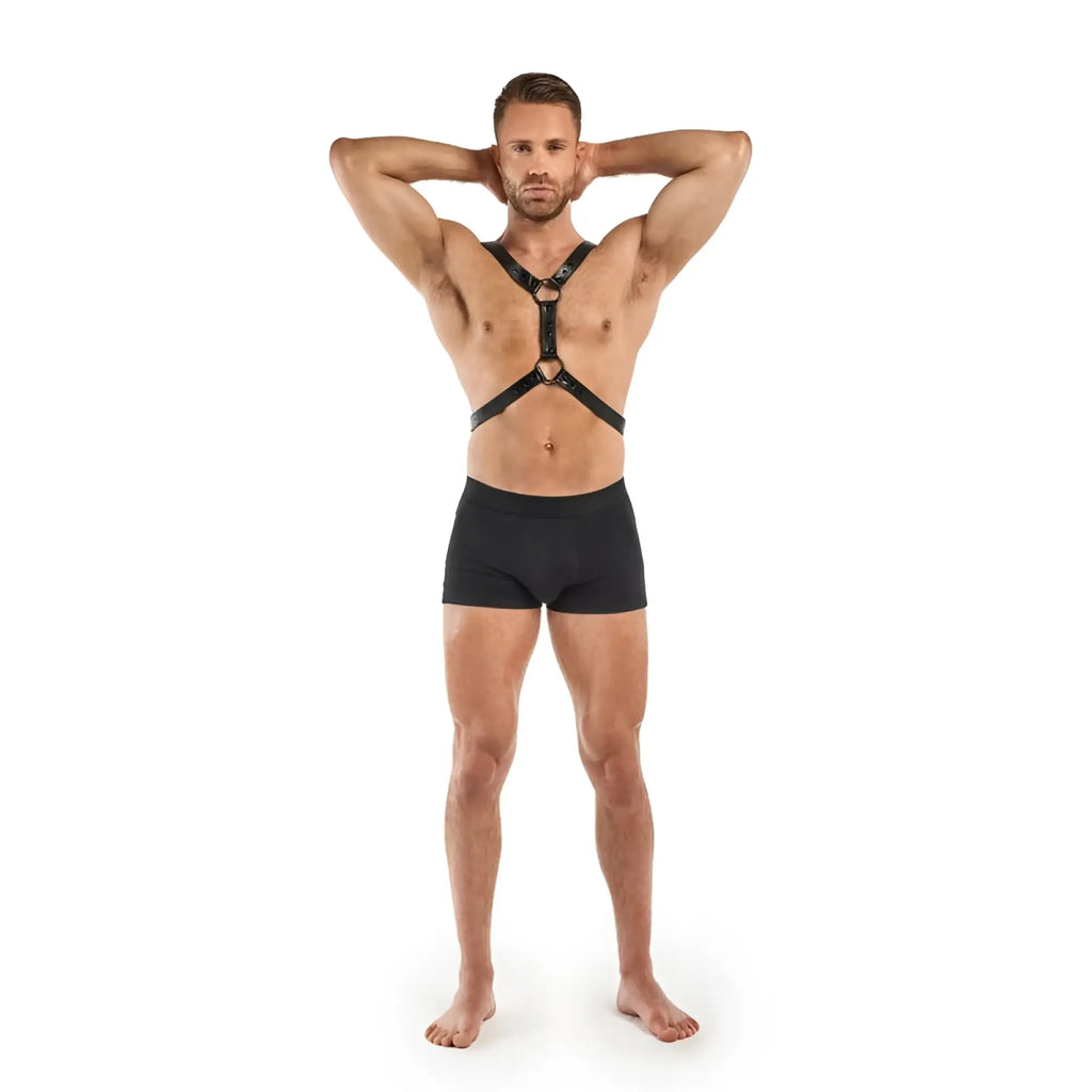 Black leather bedroom fantasies max bondage harness with adjustable straps and metal hardware shown from the back