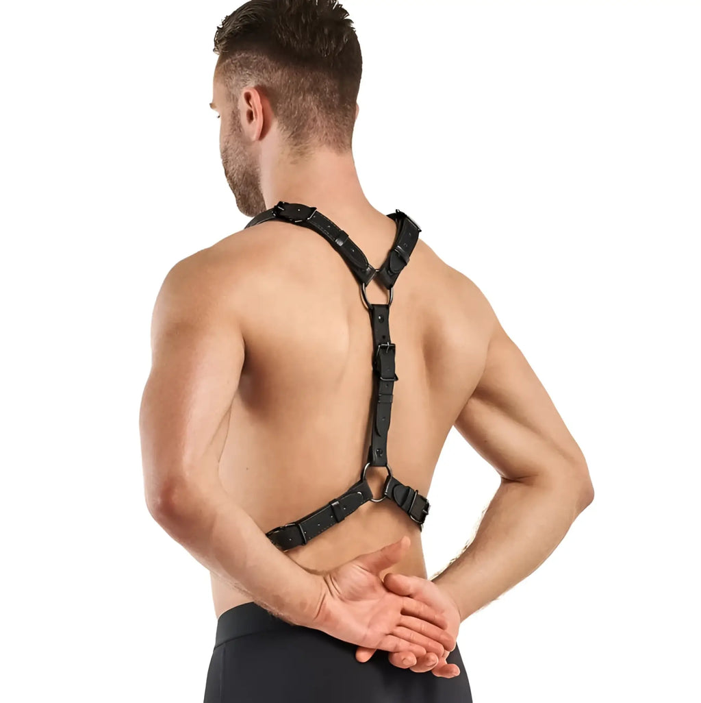 Black leather-backed bedroom fantasies max bondage harness with adjustable straps and metal buckles shown from the back