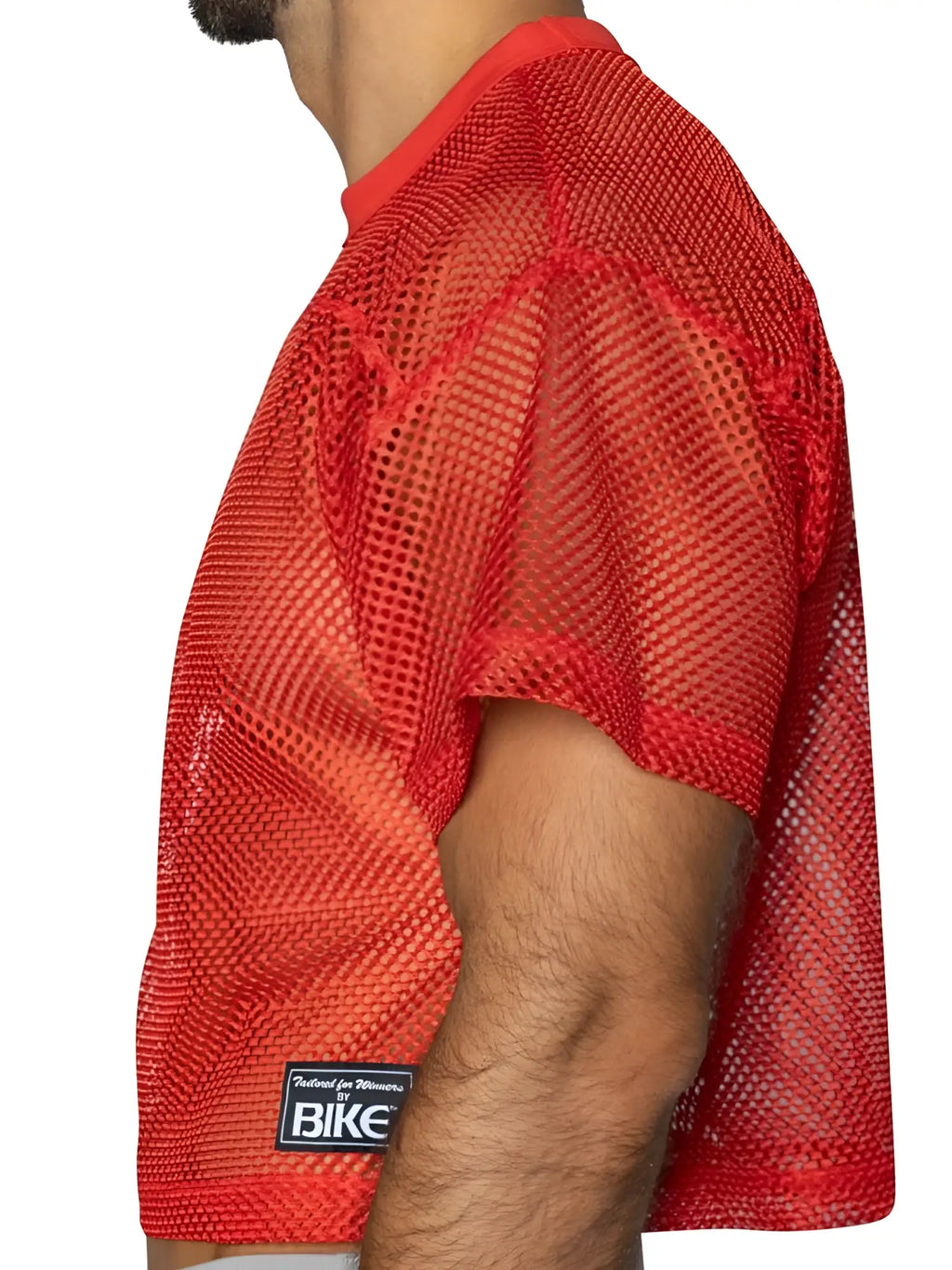 Side view of BIKE Athletic BAM134 short sleeve practice jersey in Bright Red, showcasing mesh fabric texture.