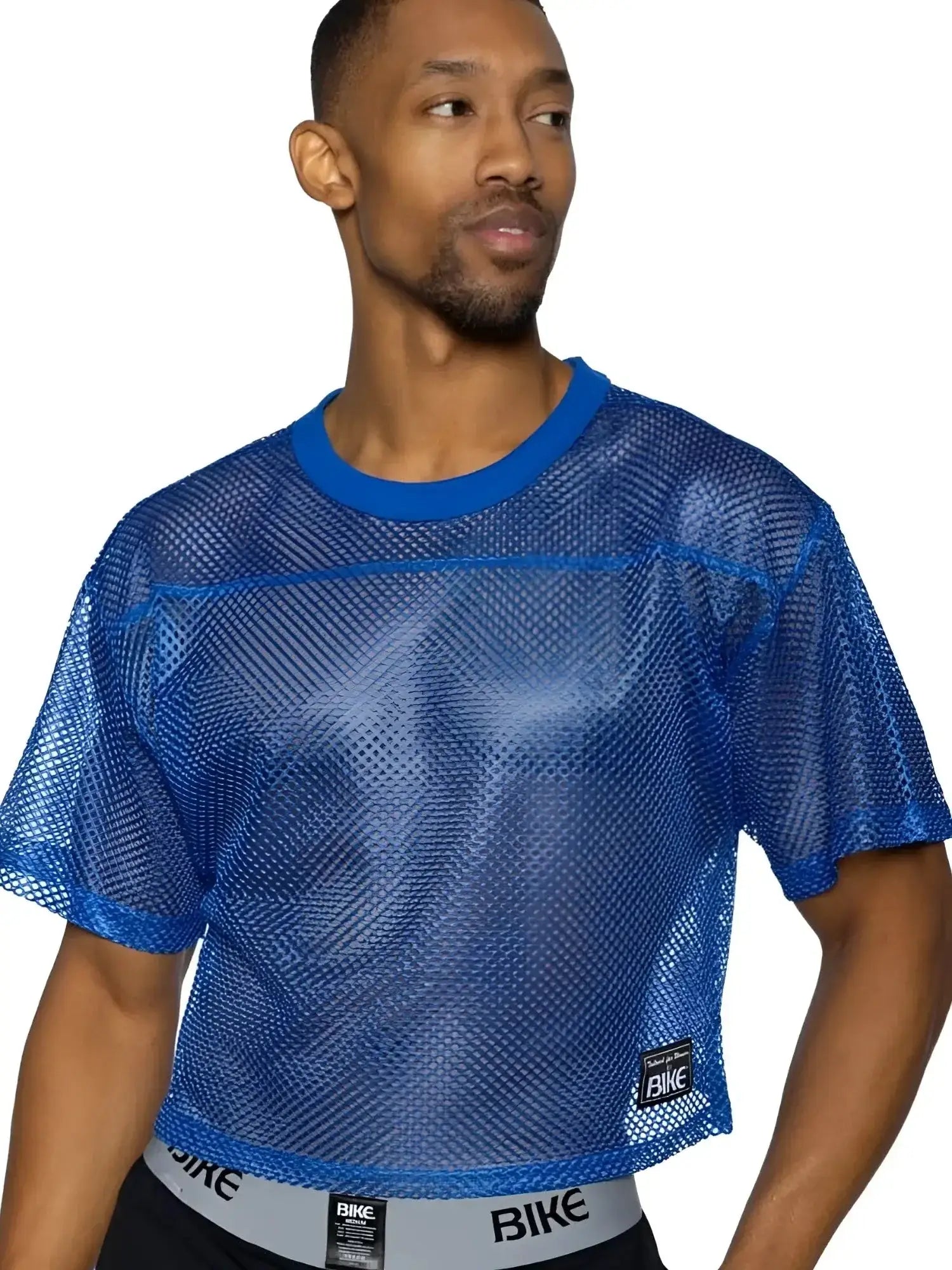 Front view of the BIKE Athletic BAM134 short sleeve practice jersey in royal blue worn by a model.