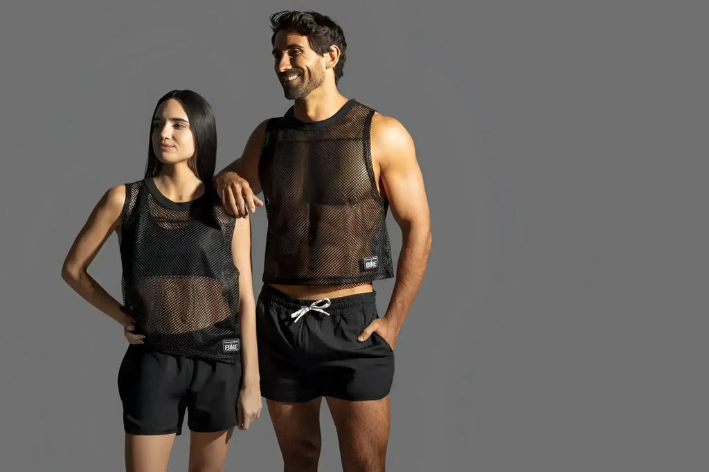 BIKE Athletic BAM135 black mesh practice jersey lifestyle shot featuring a man and woman.