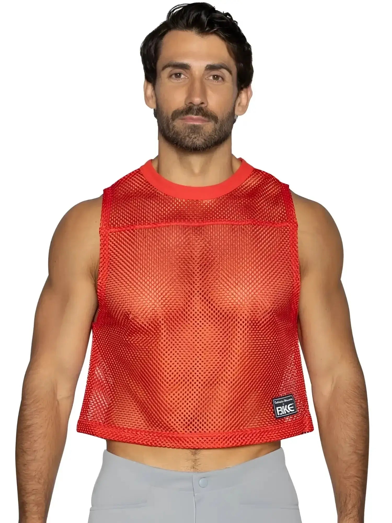 BIKE Athletic BAM135 red sleeveless practice jersey, front view on a male model.
