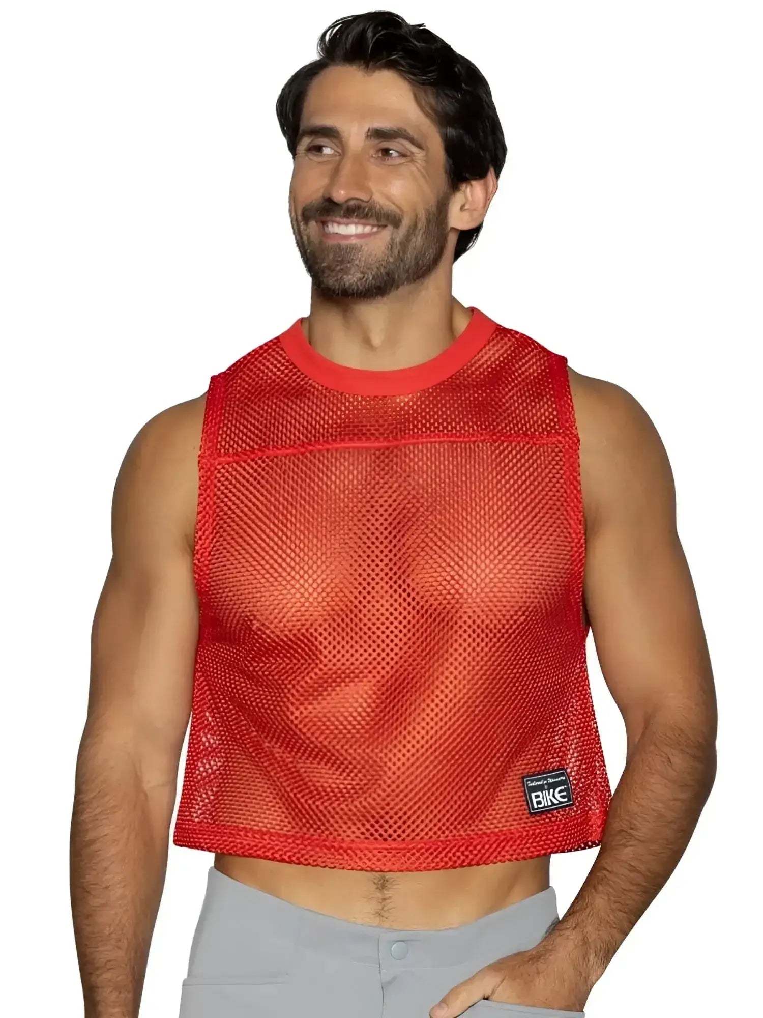 Front view of a man wearing a red BIKE Athletic BAM135 sleeveless mesh practice jersey.