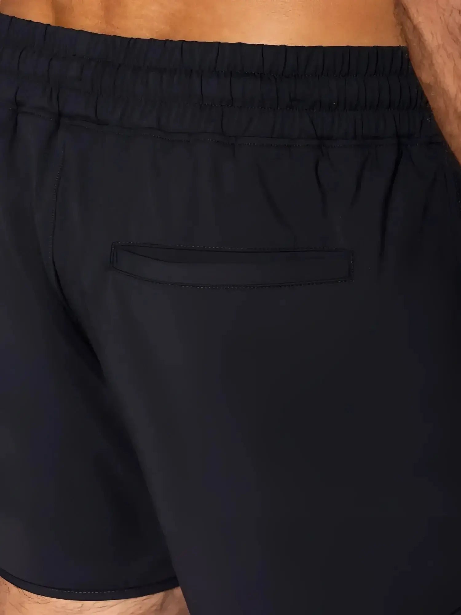 BIKE Athletic BAM200 track shorts in black, close-up lifestyle detail view of the waistband and back pocket.