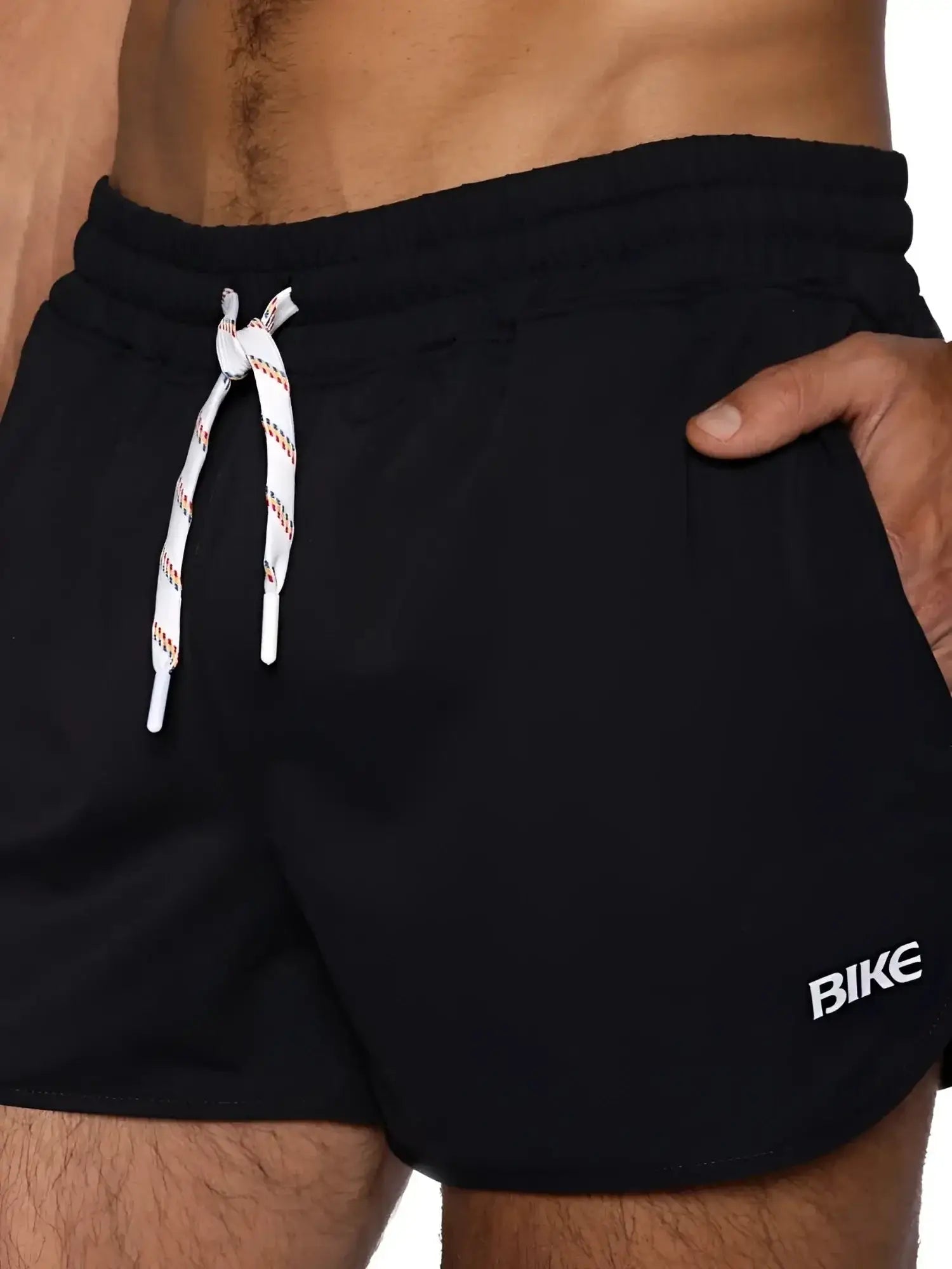 Detail view of BIKE Athletic BAM200 track shorts in black, showing the drawstring waist and logo.
