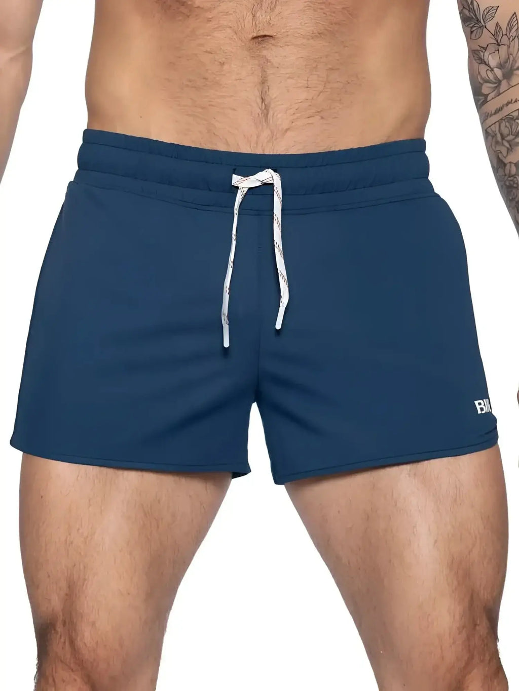 BIKE Athletic BAM200 track shorts in navy, front view on a model.