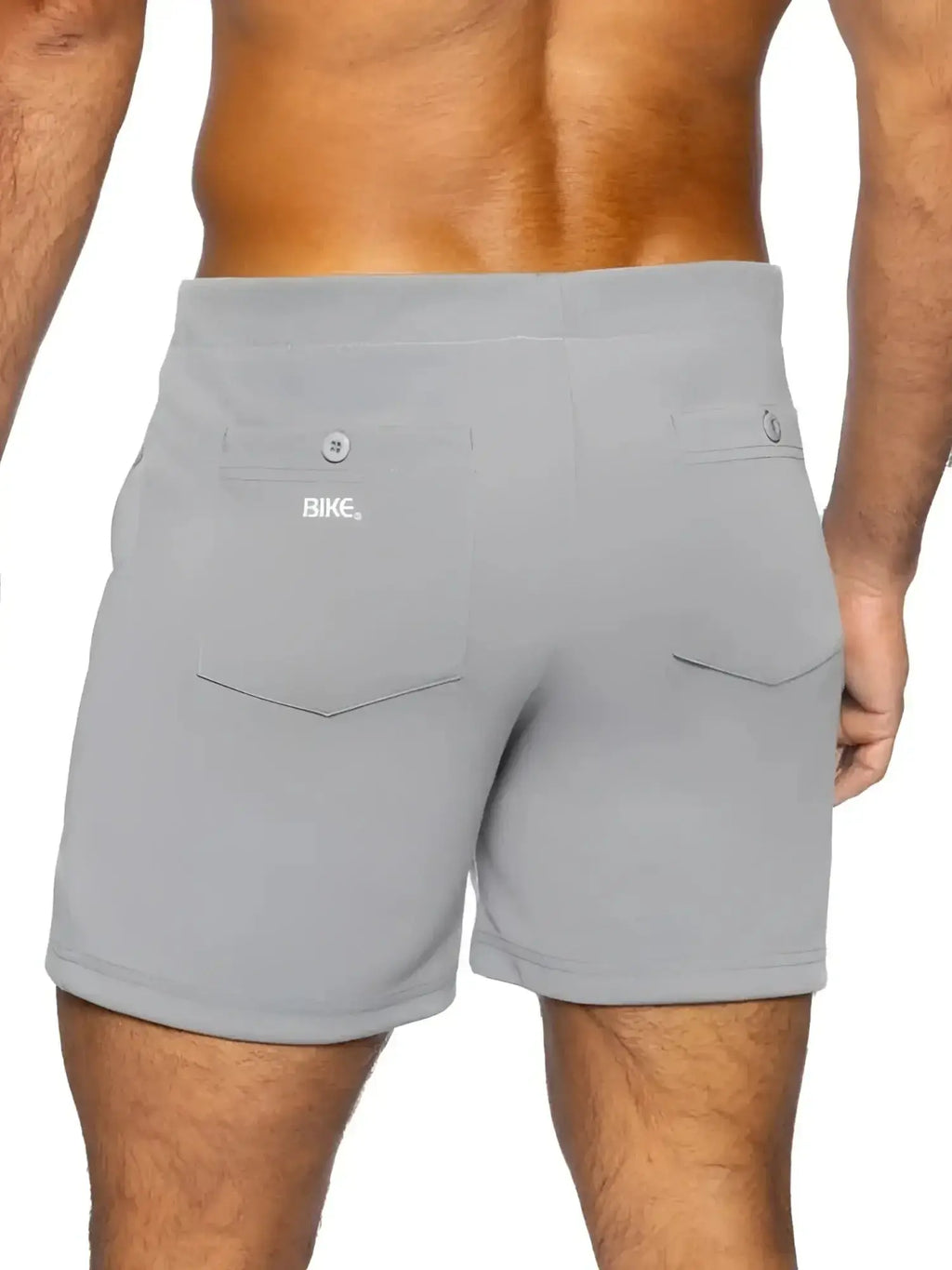 Back view of gray BIKE Athletic BAM207 5-inch inseam casual coach's shorts on a male model.