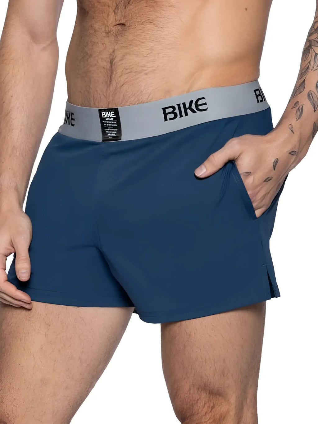 Men’s navy blue athletic shorts in a smooth, stretch fabric with a grey elastic waistband featuring the BIKE logo.