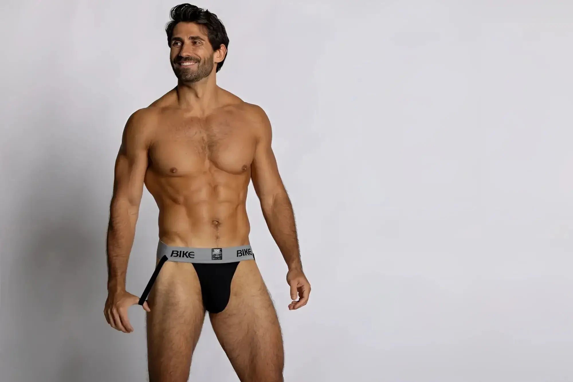 BIKE Athletic BAS303 Classic jockstrap in black. Model wearing the jockstrap, front view.