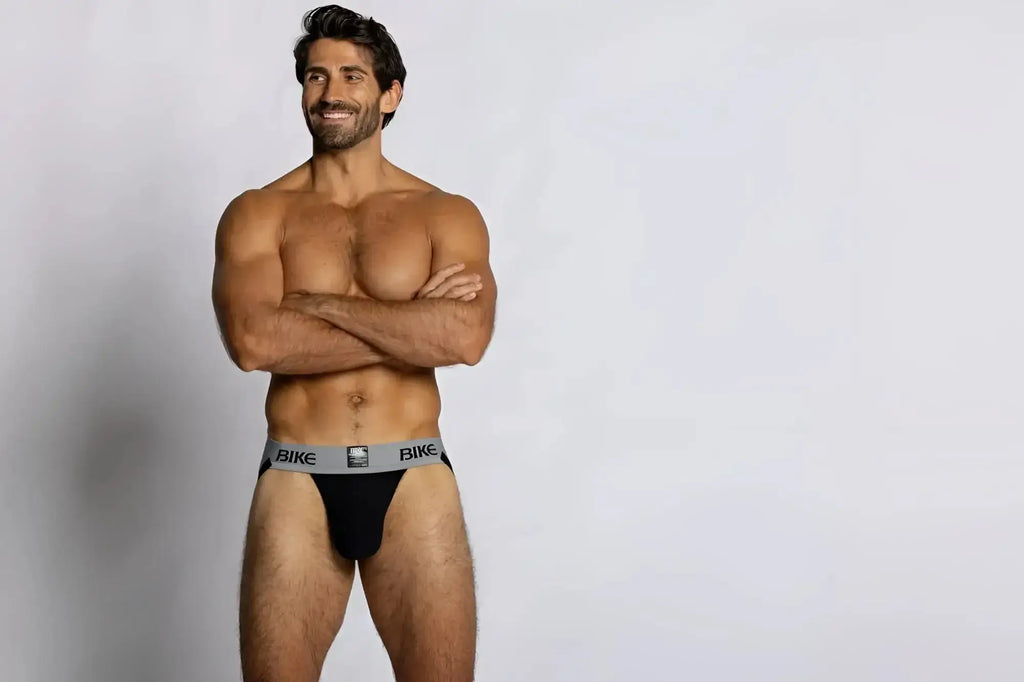 Front view of a man wearing a black BIKE Athletic BAS303 Classic jockstrap against a white background.
