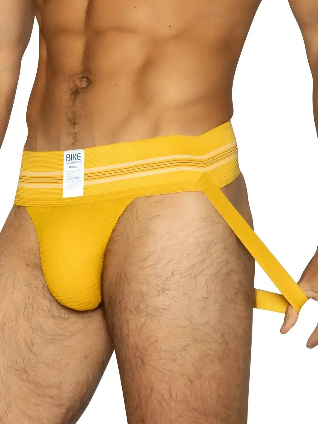 BIKE Athletic BAS306 Original Number 10 jockstrap in yellow, front view on a model holding the leg strap.