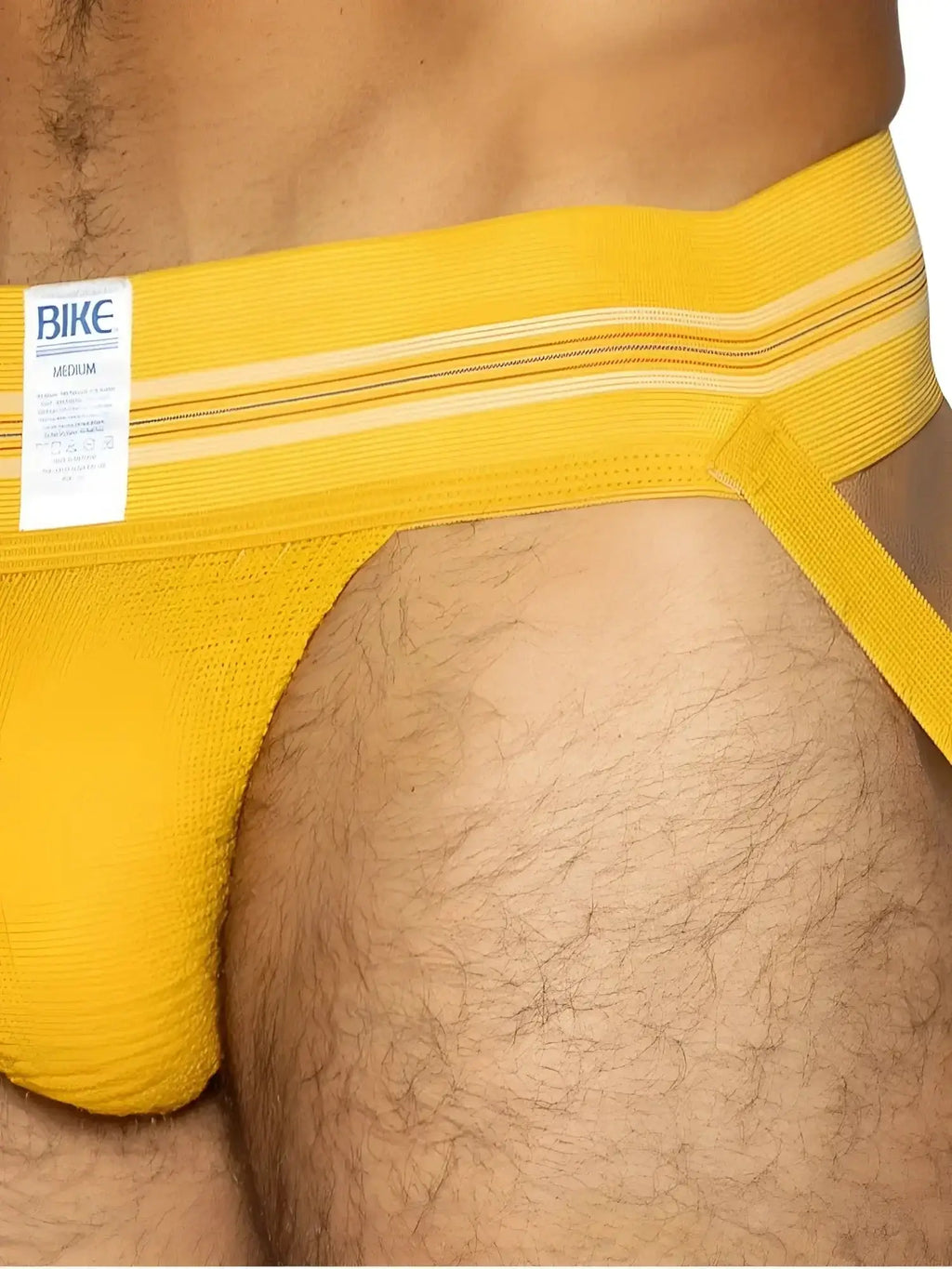 BIKE Athletic BAS306 Original Number 10 jockstrap in yellow, worn in a lifestyle product view.
