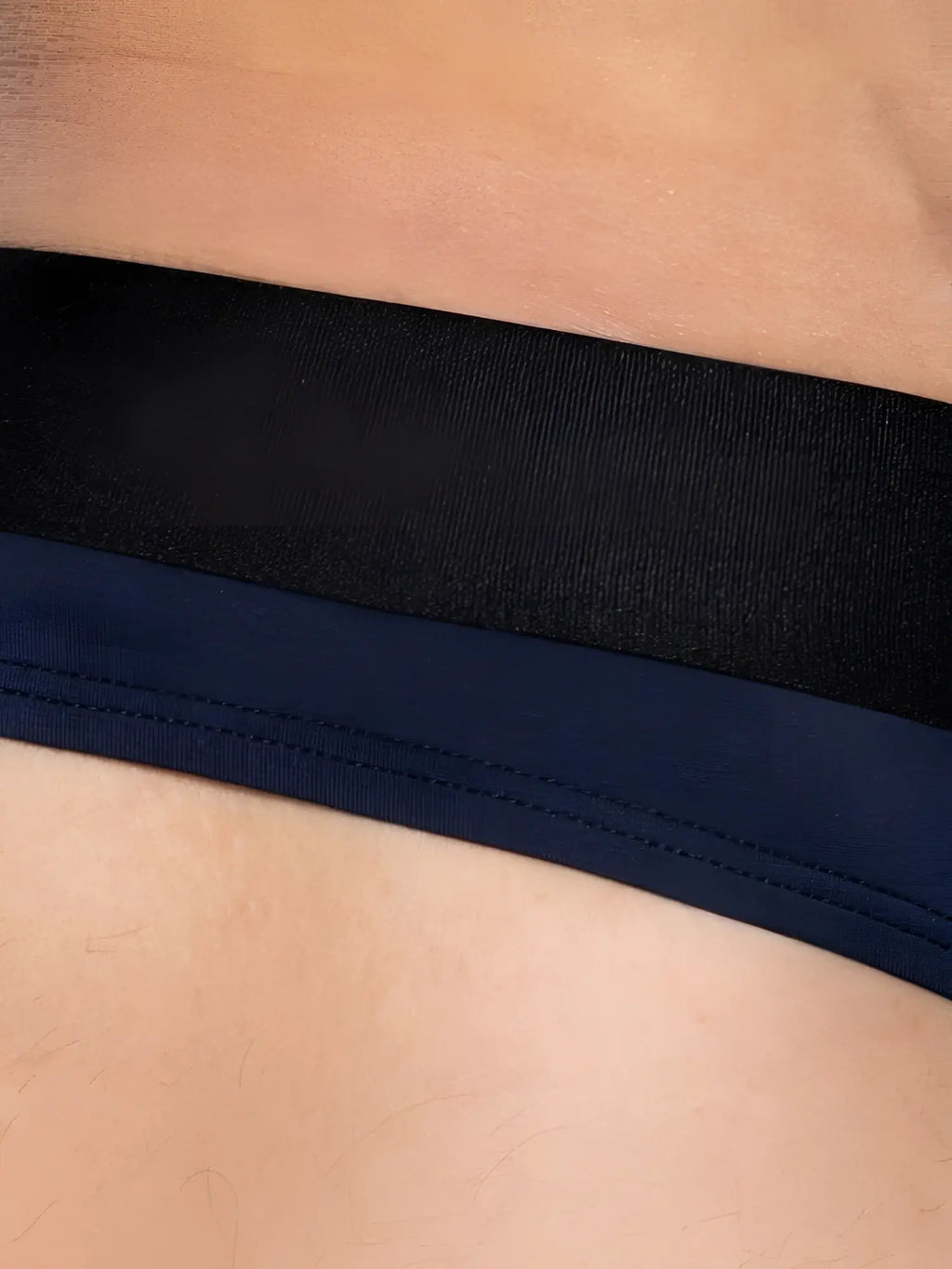 Detail view of BIKE Athletic BAS319 Active Thong in navy blue showing the waistband.