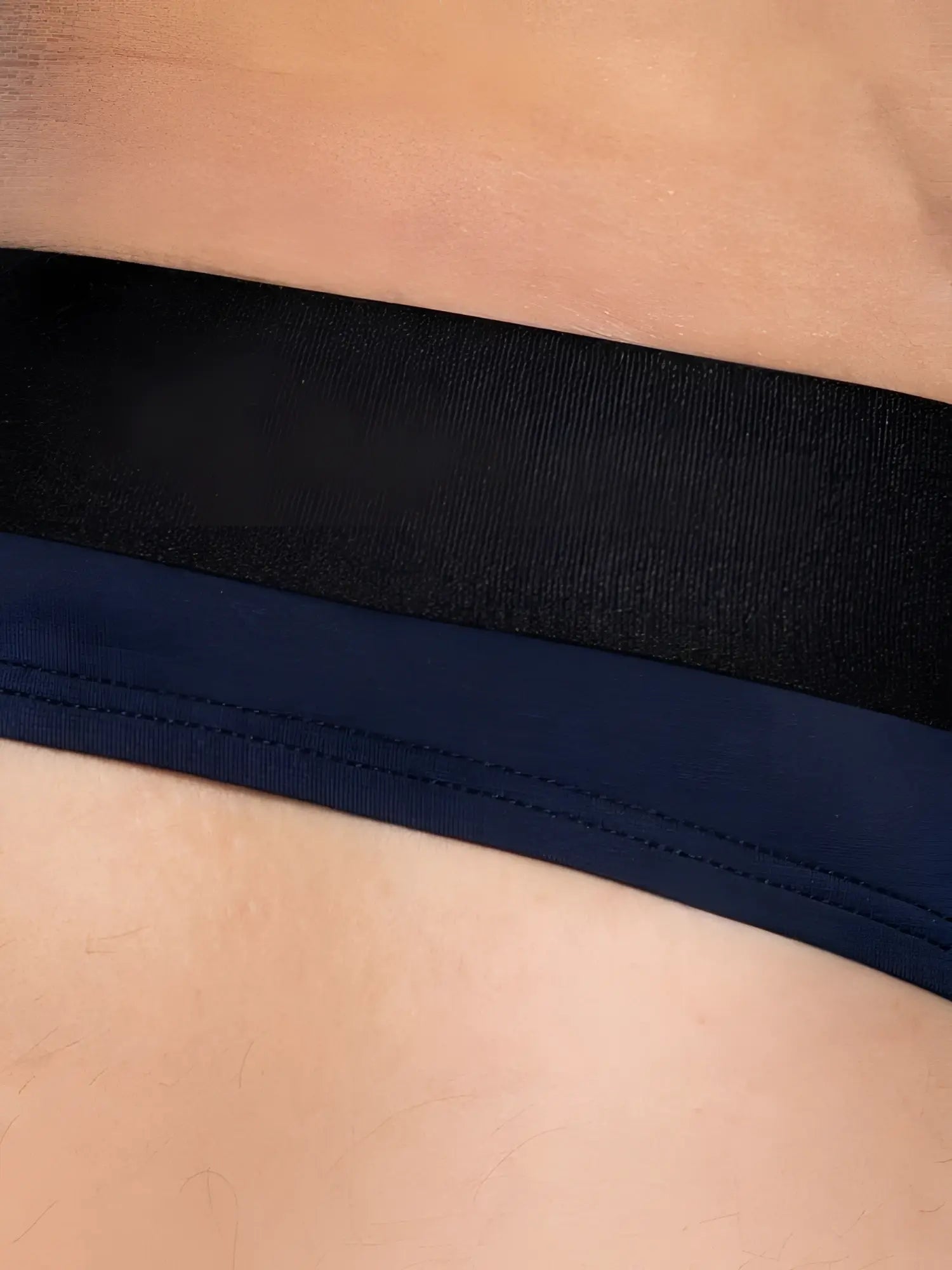Detail view of BIKE Athletic BAS319 Active Thong in navy blue showing the waistband.