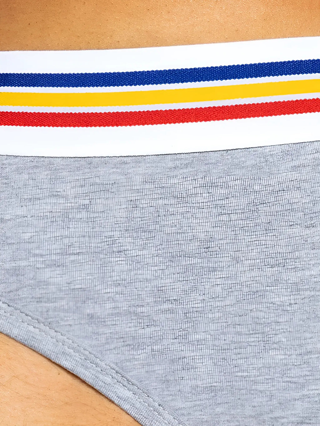 Detail view of gray BIKE Athletic BAS327 stretch cotton brief with a multicolored striped waistband.