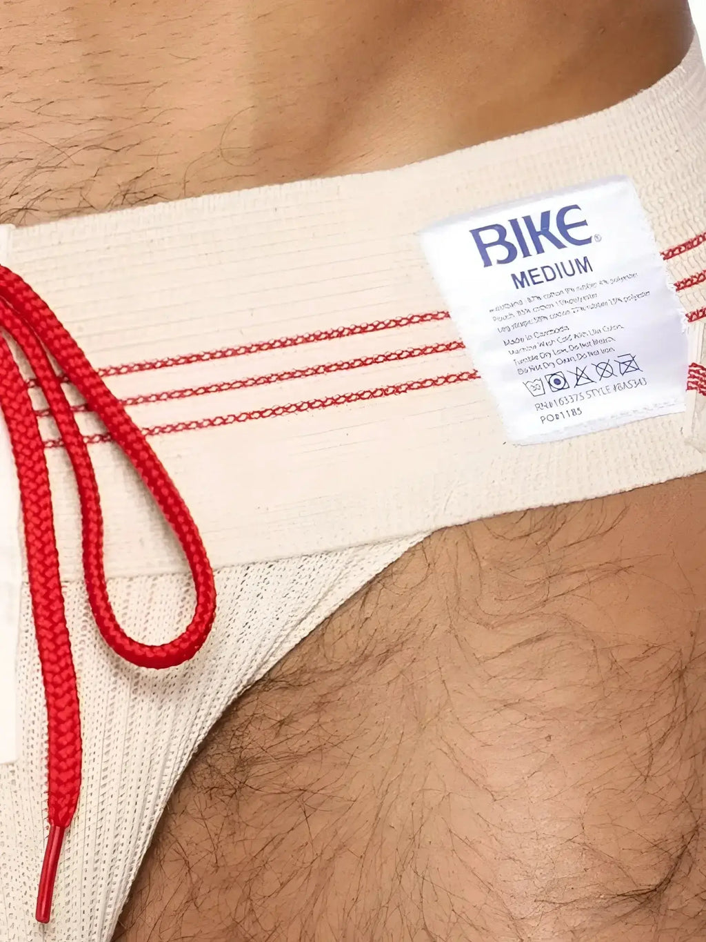 Close-up detail view of the BIKE Athletic BAS343 vintage lace-up jockstrap in vintage cream.