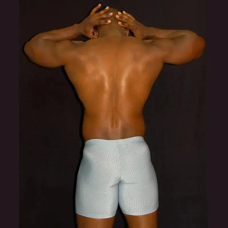 Men's compression cycling shorts in light blue featuring a fitted design shown on a model from the back by Arroyman.