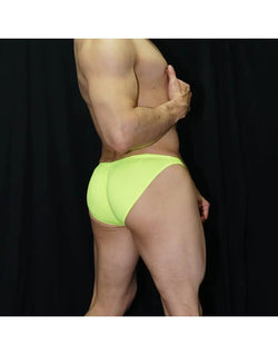Men's yellow neon bikini underwear by Arroyman featuring a snug fit and smooth fabric shown from the side.