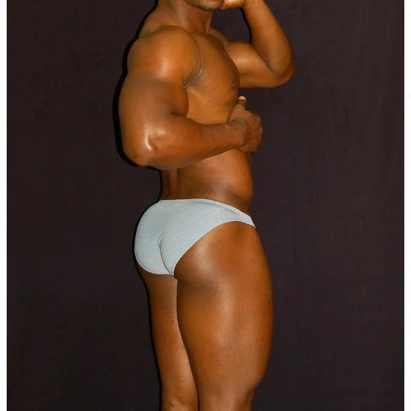 Gray bikini underwear by Arroyman featuring a snug fit and smooth fabric shown on a model from the side.
