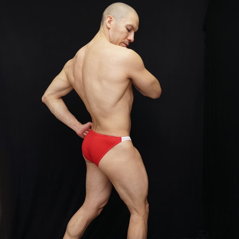 Red mesh bikini underwear by Arroyman featuring a snug fit and contrasting white waistband modeled from the back.
