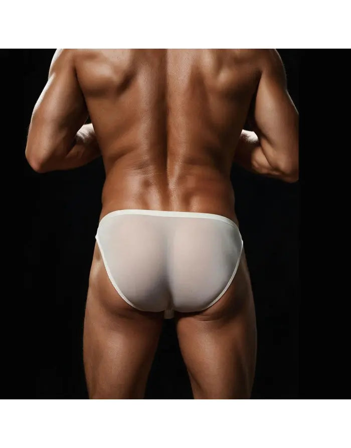 Cream silky bikini underwear for men by Arroyman featuring a smooth sheer fabric and a snug fit shown on a model from the back.