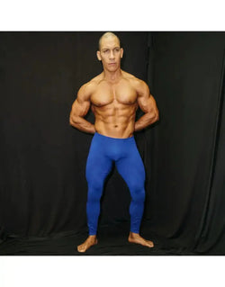 Men's blue spandex tights by Arroyman featuring a fitted design smooth texture and full-length coverage worn by a model.