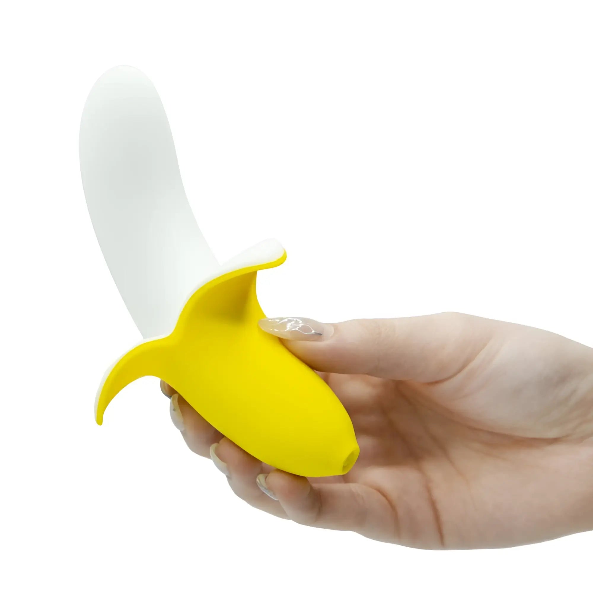 Yellow and white silicone banana-shaped vibrator held in hand bms banana bliss 13cm slimline massager