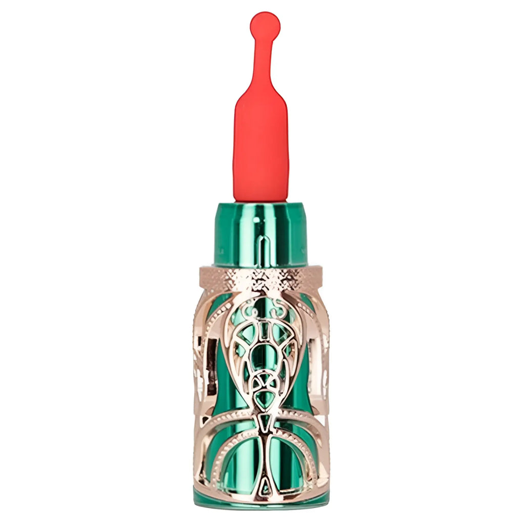 A sleek emerald-green glass bms emerald kiss 4 in 1 lipstick vibrator with rose-gold filigree and red silicone applicator