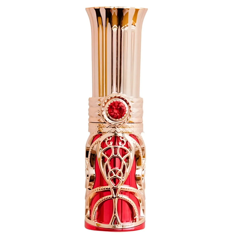 A luxurious red and gold bms ruby kiss 4 in 1 lipstick vibrator with intricate filigree and ruby gemstone accent