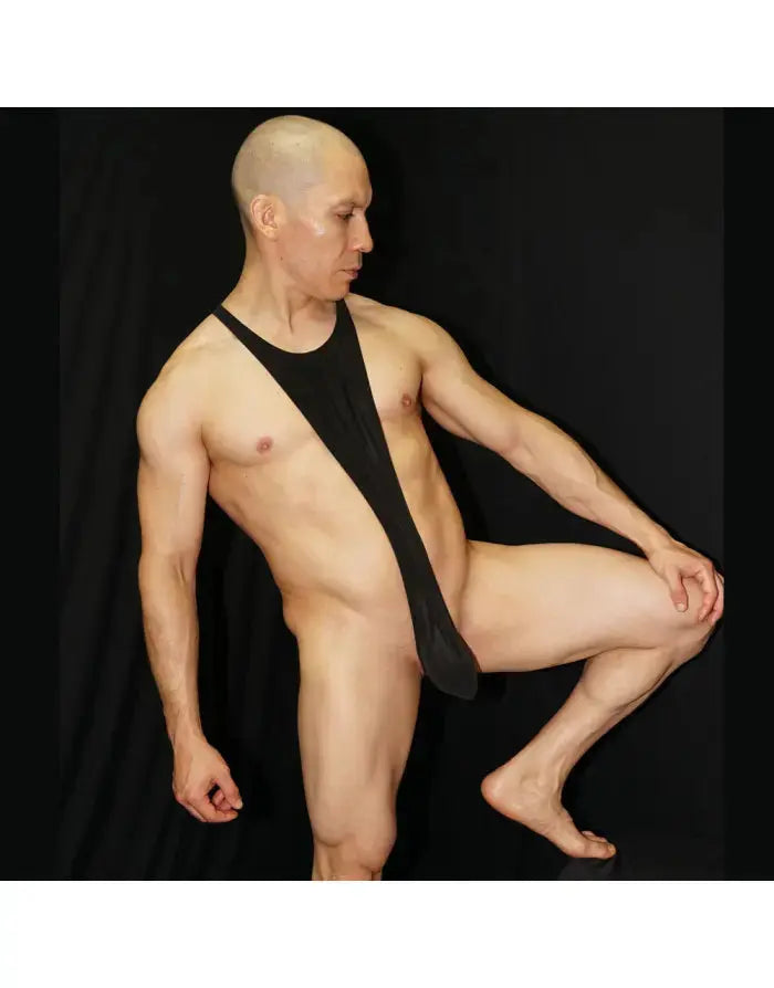 Black eco-leather bodysuit thong with a unique design worn by a model from Arroyman.