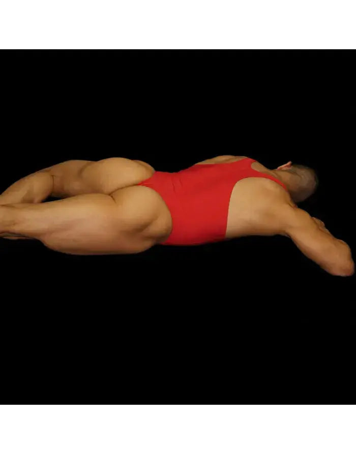Red bodysuit thong made of stretchy material featuring a racerback design shown on a model from the back by Arroyman