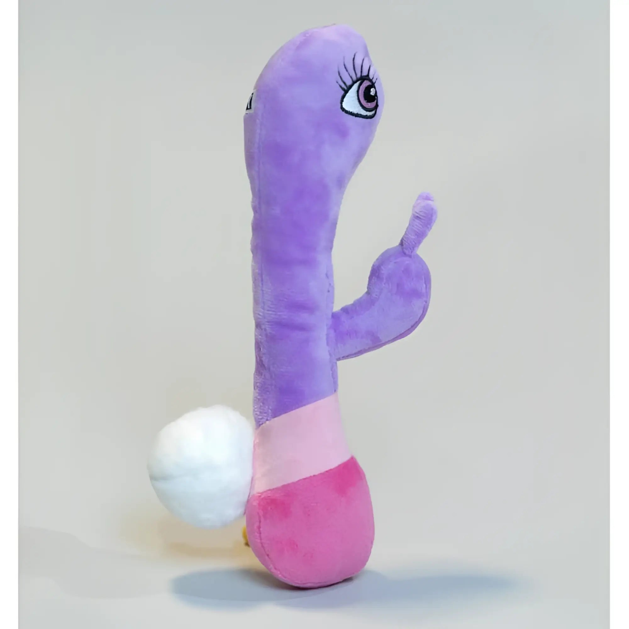 Purple plush bunny toy from boneyard scruffy pet toys with slender body pink lower section and white tail ball