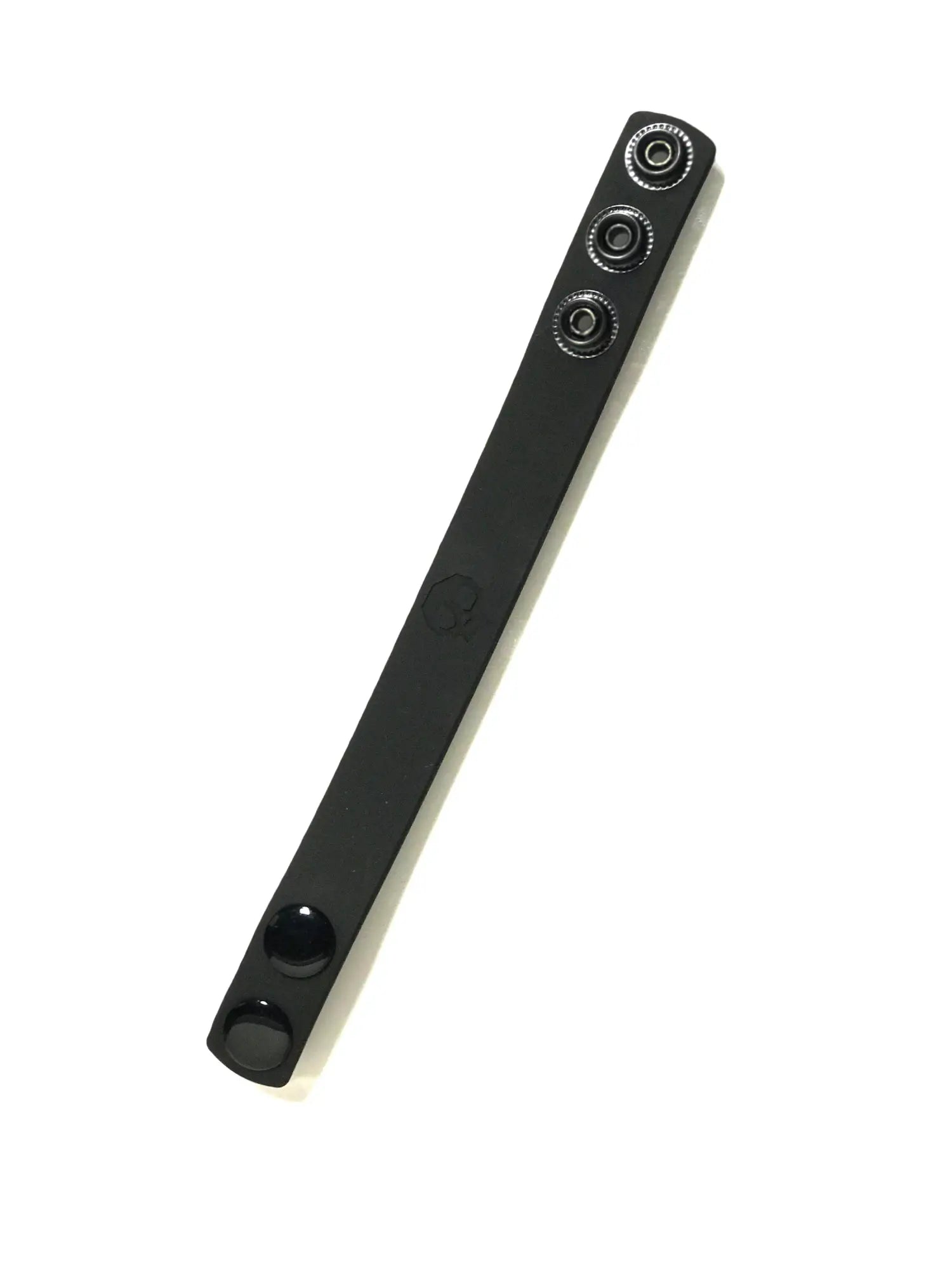 Black leather boneyard silicone cock strap with three silver-toned snap buttons along its length
