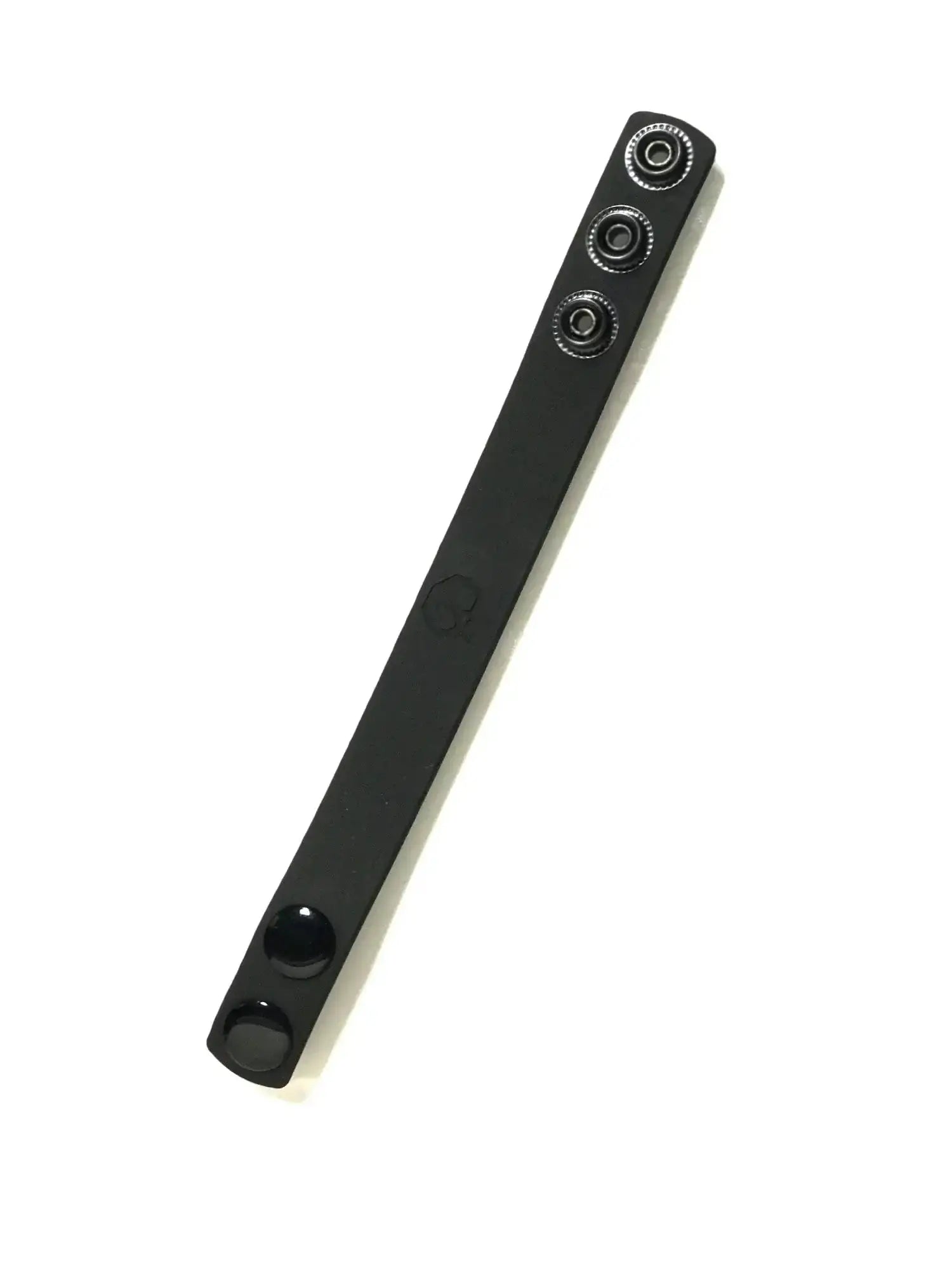 Black leather boneyard silicone cock strap with three silver-toned snap buttons along its length