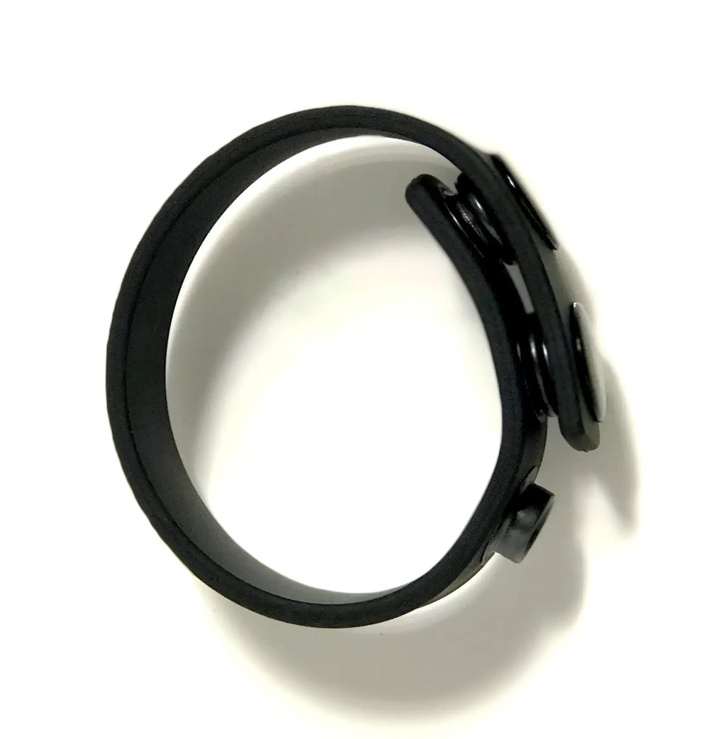Black silicone wristband cock strap by Boneyard Boneyard with a sleek minimalist design and adjustable clasp mechanism