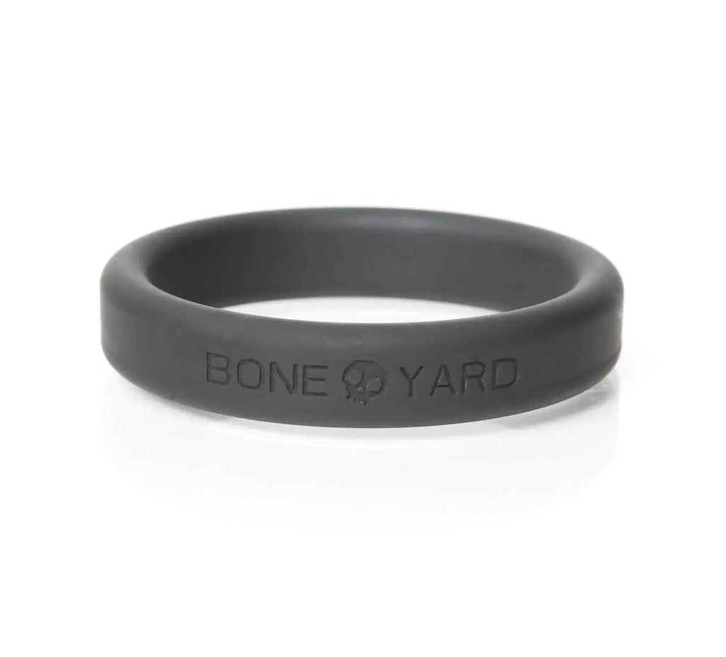 Black silicone boneyard ring with bone yard engraving inside shown from the back in 5 pc kit